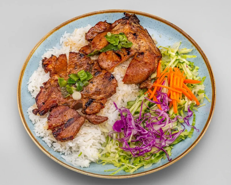 Pork Chops on Rice with lettuce, cucumber, pickled carrots and cabbage at Bon Vietnamese Cuisine, Redstone, Calgary